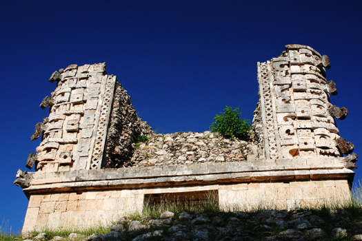 A building adorned with Chaac masks overlooking the Nun's Quadrangle