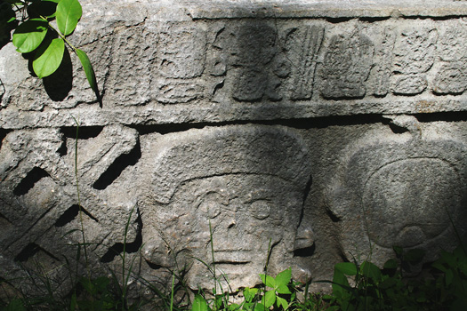 Carved hieroglyphs of a human skull at Grupo del Cementario